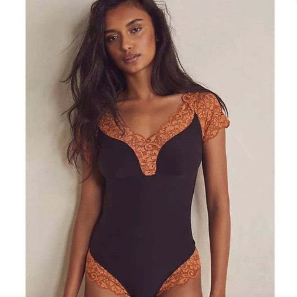 We are HAH black bodysuit orange lace “top heavy” - small